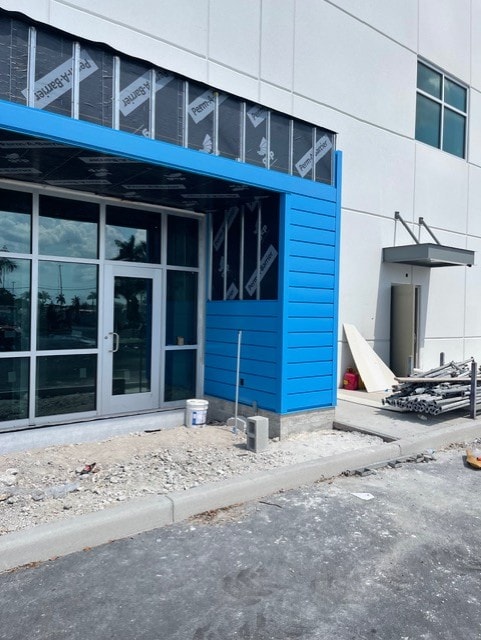 Blue EIFS storefront facade under construction