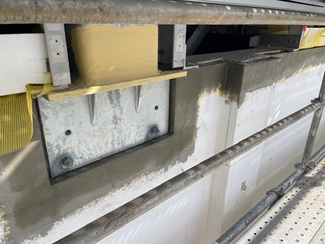 Close-up of EIFS anchor and base coat detail