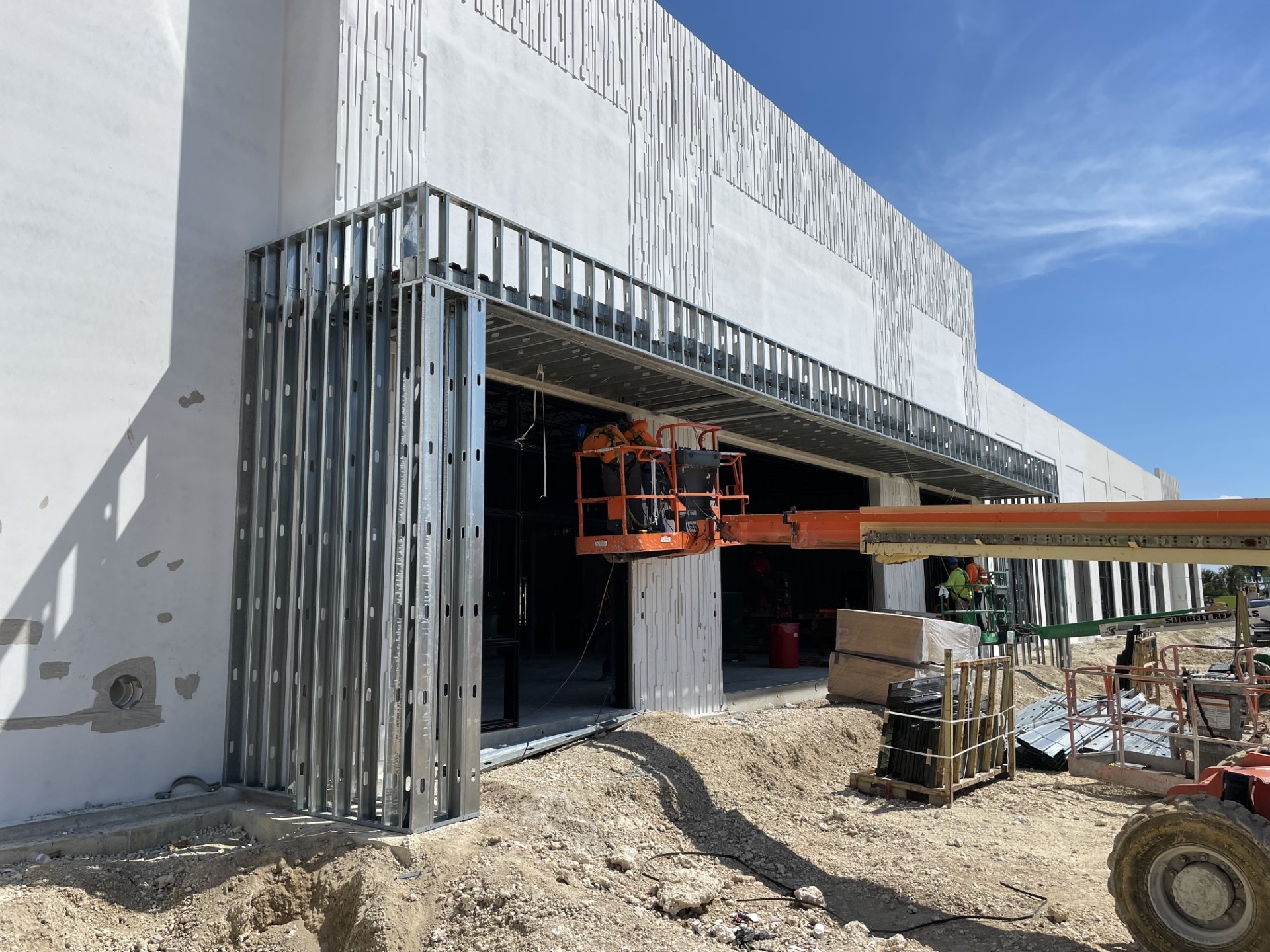 Exterior framing with scissor lift on active site