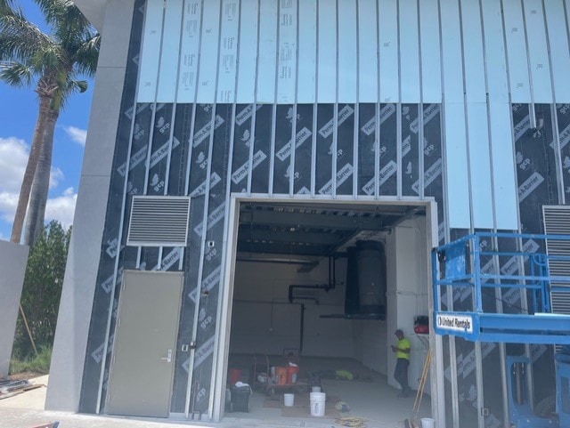 Exterior sheathing and weather wrap installation