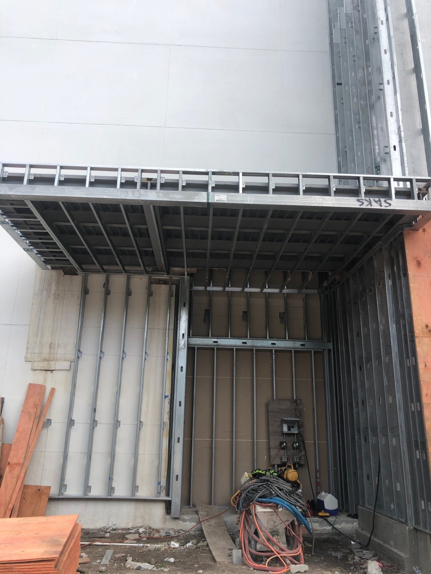 Steel stud framing and soffit grid — Saks facade project