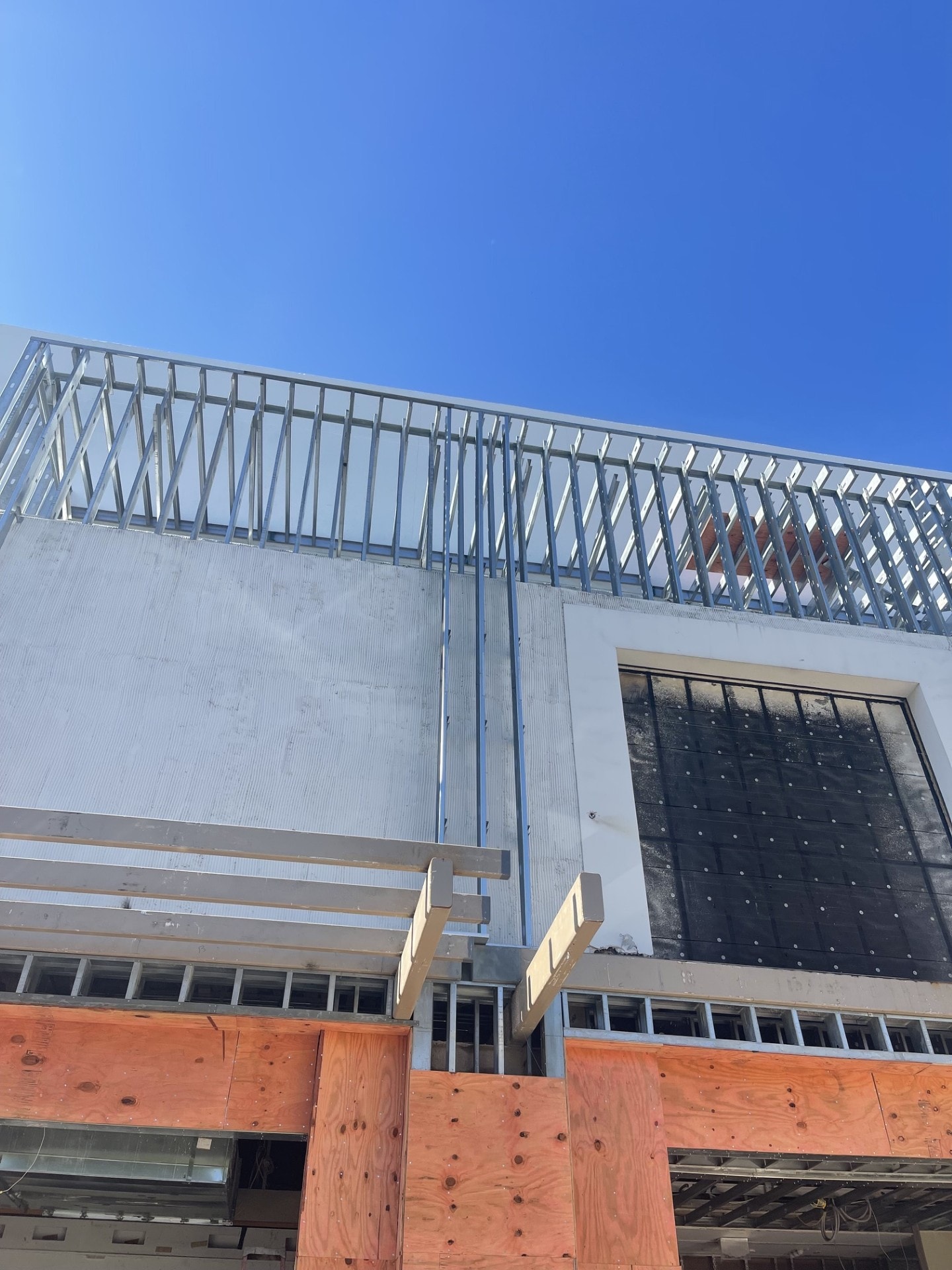 Steel framing roofline against blue sky