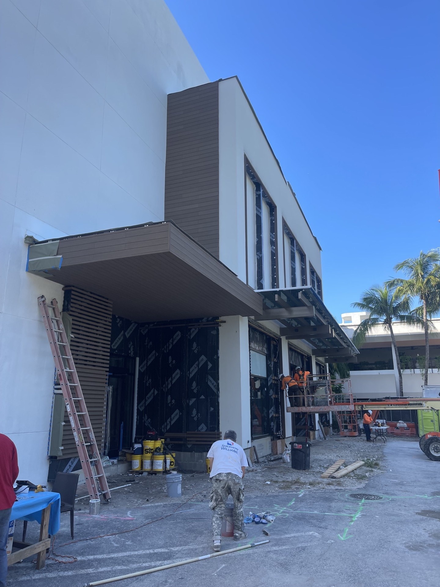 Commercial storefront construction with stucco and wood cladding — Miami